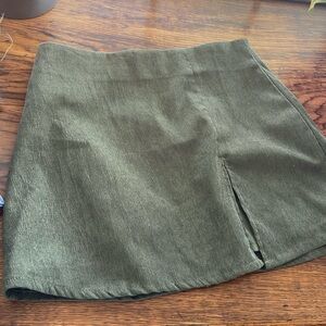 Dark green mini skirt with small slit